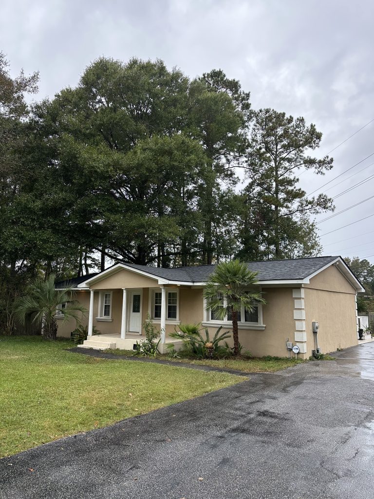 item_0c900c48-e4e4-42d0-b51c-09af899107f8 Tan single-story home with a covered front porch and new shingle roof in Myrtle Beach, SC