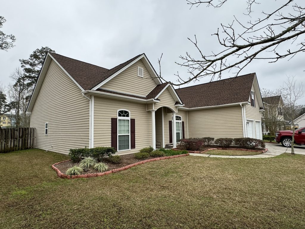 item_671a3393-7527-4cea-9f24-e769bd395f22 Single-story brick home with a two-car garage and newly installed shingle roof in Savannah, GA