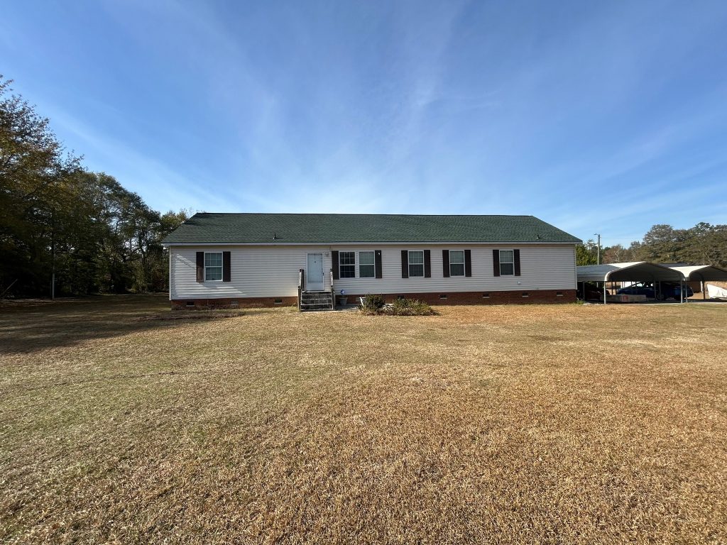 item_bfce4c89-5145-49c5-b9a5-88a335ff6916 Single-story home with a new architectural shingle roof and landscaped walkway in Savannah, GA