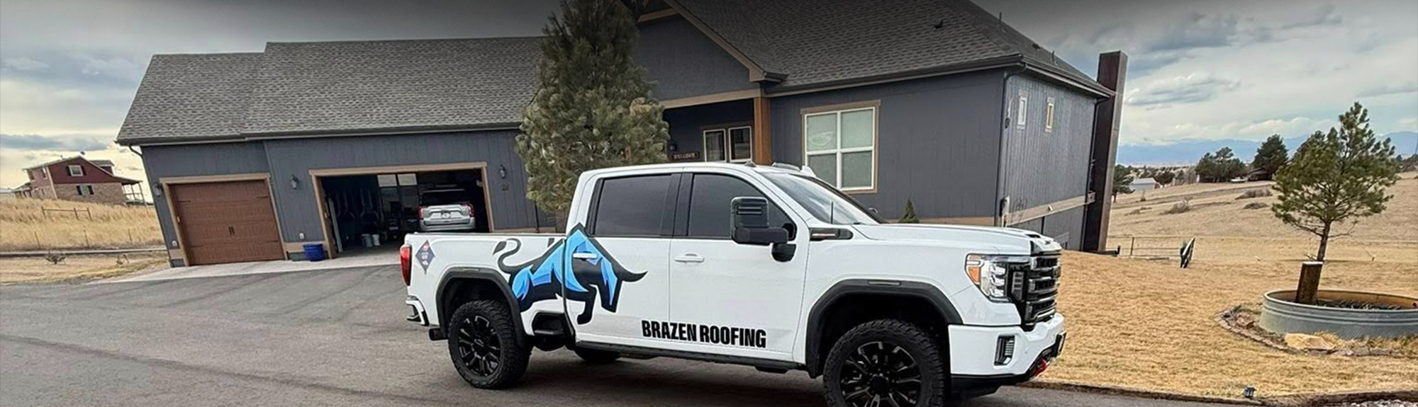 Brazen Roofing truck outside a home during a hail damage roof inspection in the Denver, CO area