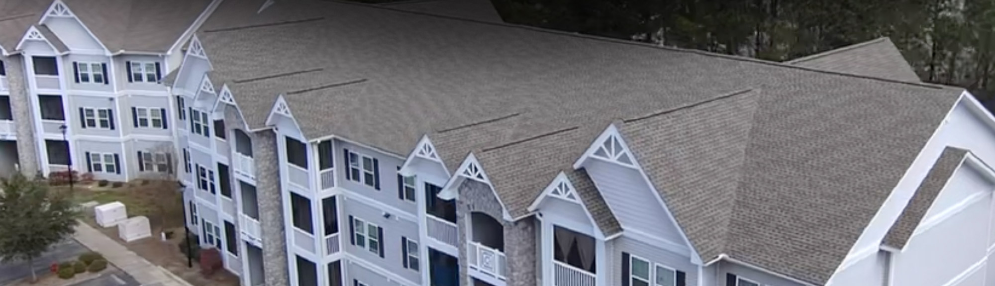 Aerial view of a large multi-family apartment complex roof