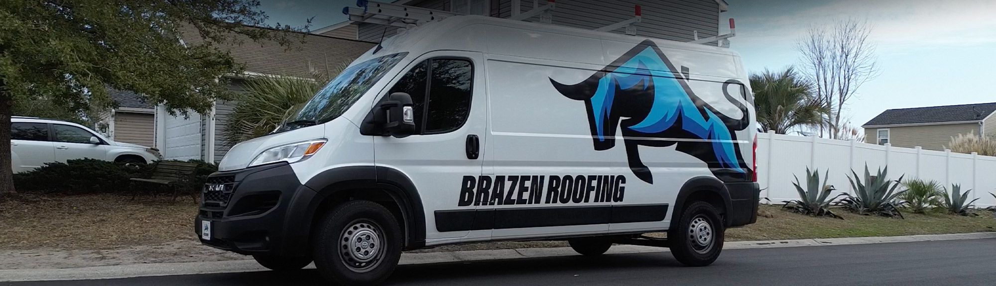 Brazen Roofing service van parked in a residential neighborhood